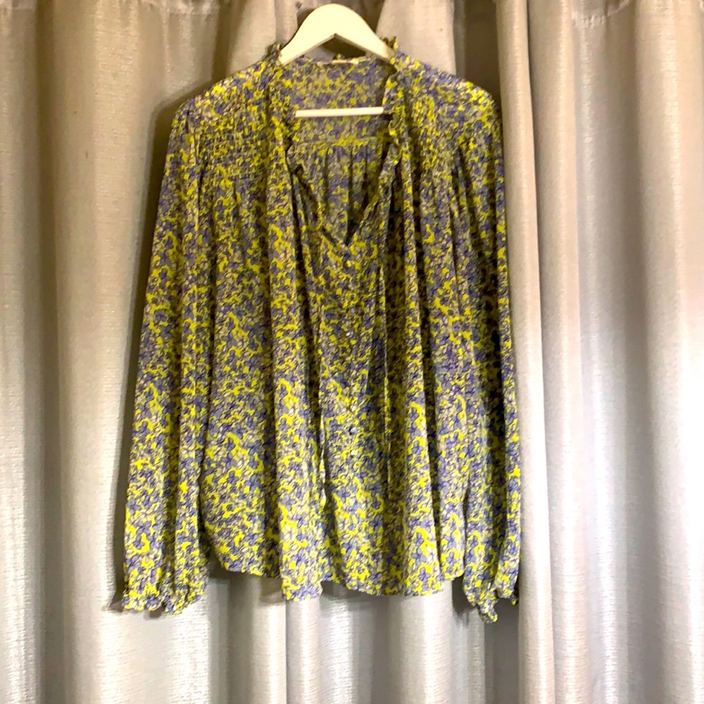 Flowery yellow top, loose and very flattering. Faux buttons, long sleeve